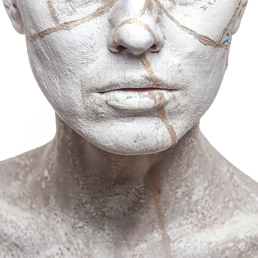 woman portrait covered in clay